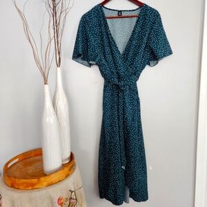 Womans green polka-dot wrap dress